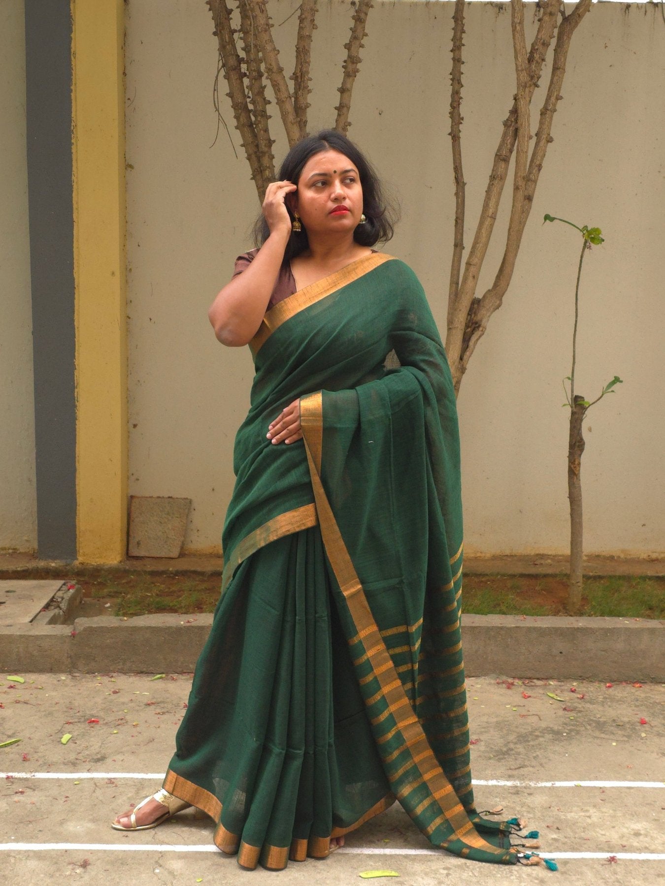 Qala - Green Linen Saree with Copper Zari border