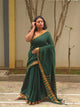 Qala - Green Linen Saree with Copper Zari border