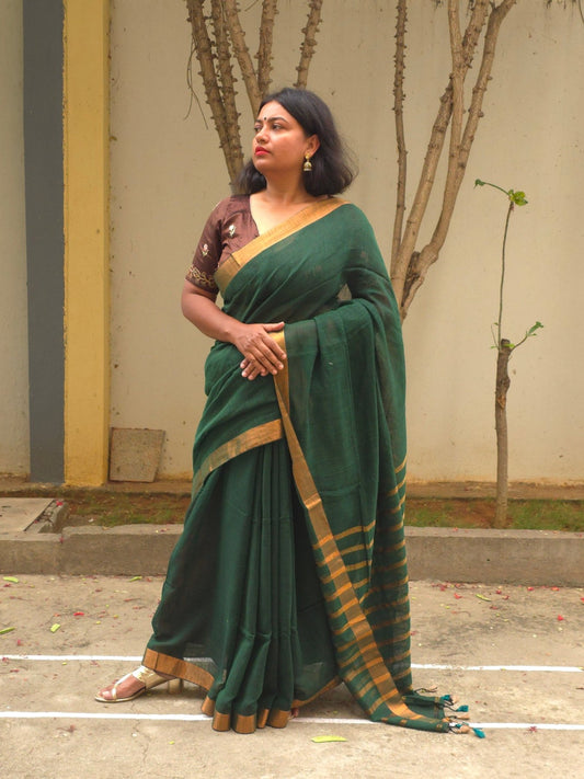 Qala - Green Linen Saree with Copper Zari border