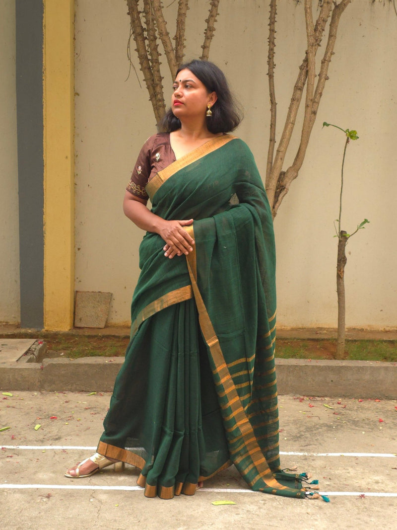 Qala - Green Linen Saree with Copper Zari border