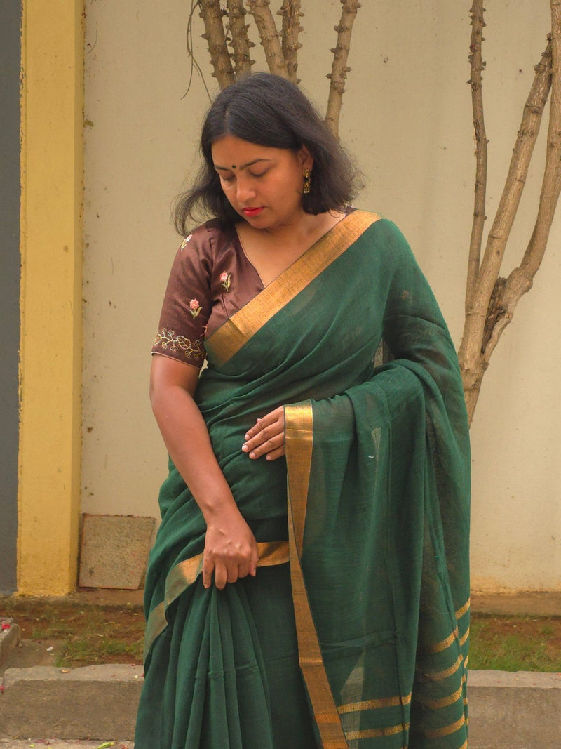 Qala - Green Linen Saree with Copper Zari border