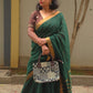 Qala - Green Linen Saree with Copper Zari border