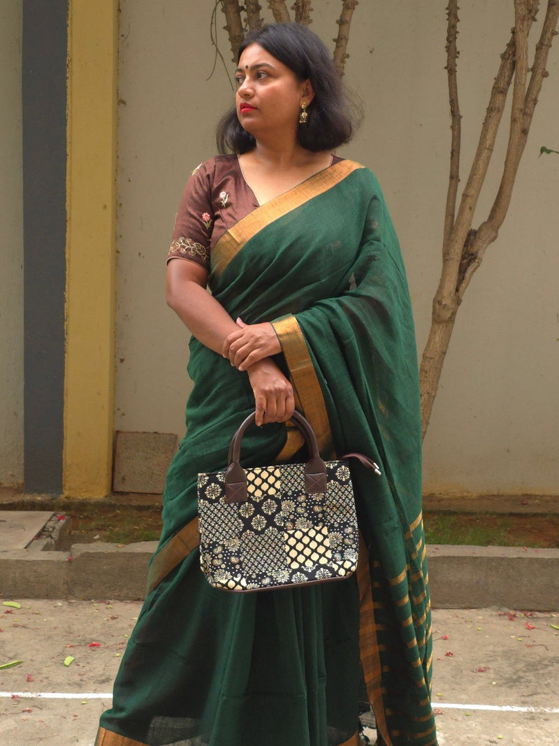 Qala - Green Linen Saree with Copper Zari border