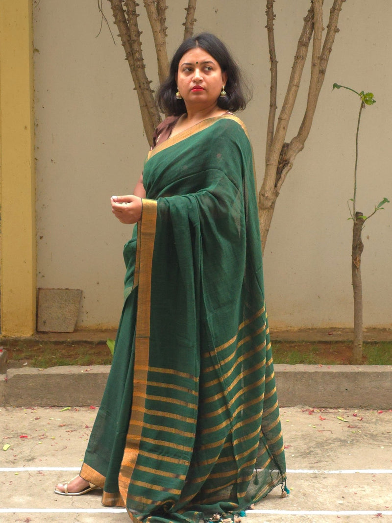 Qala - Green Linen Saree with Copper Zari border