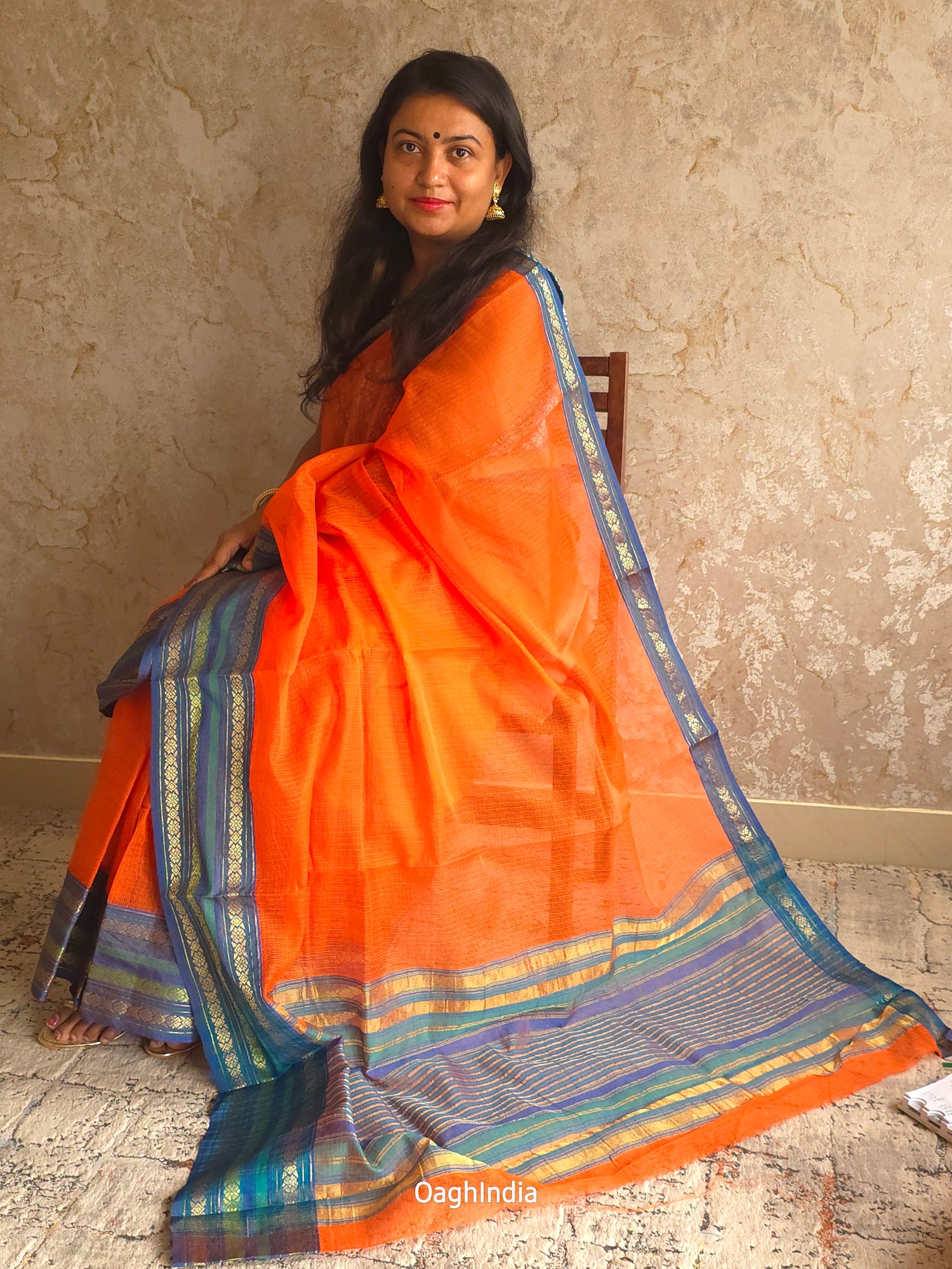 Tamhini: Pure kota doria cotton sarees with exquisite zari chit border ( Fire Orange )