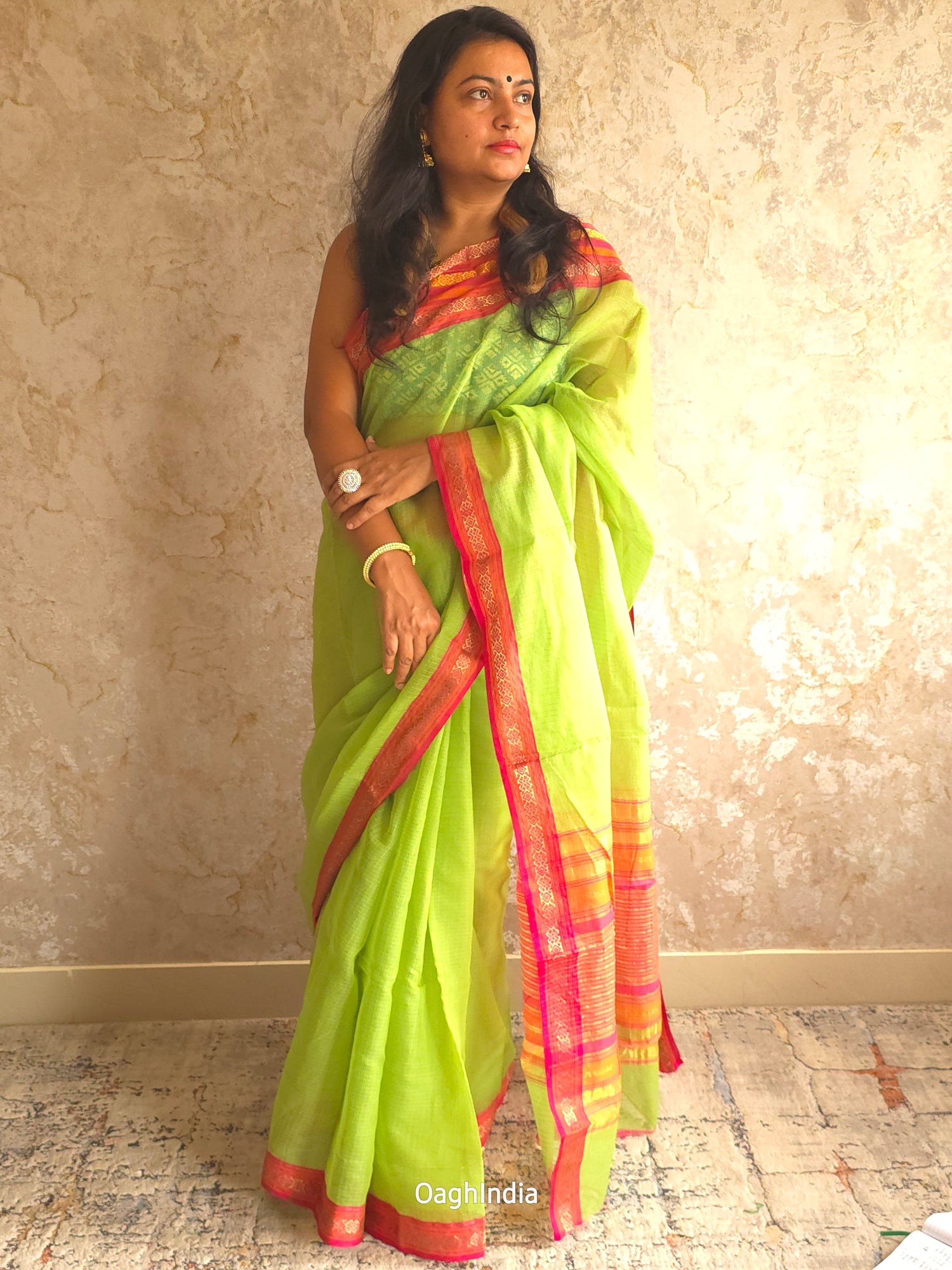 Tamhini: Pure kota doria cotton sarees with exquisite zari chit border ( Parrot Green )