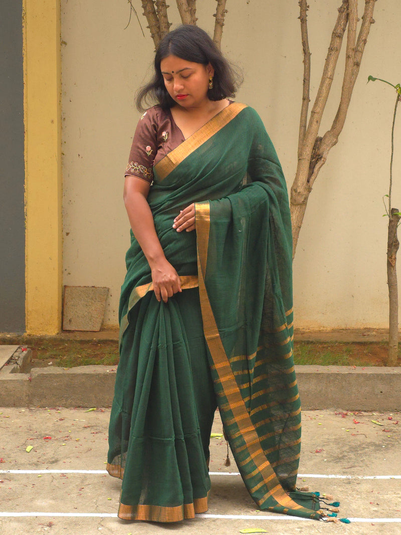Qala - Green Linen Saree with Copper Zari border
