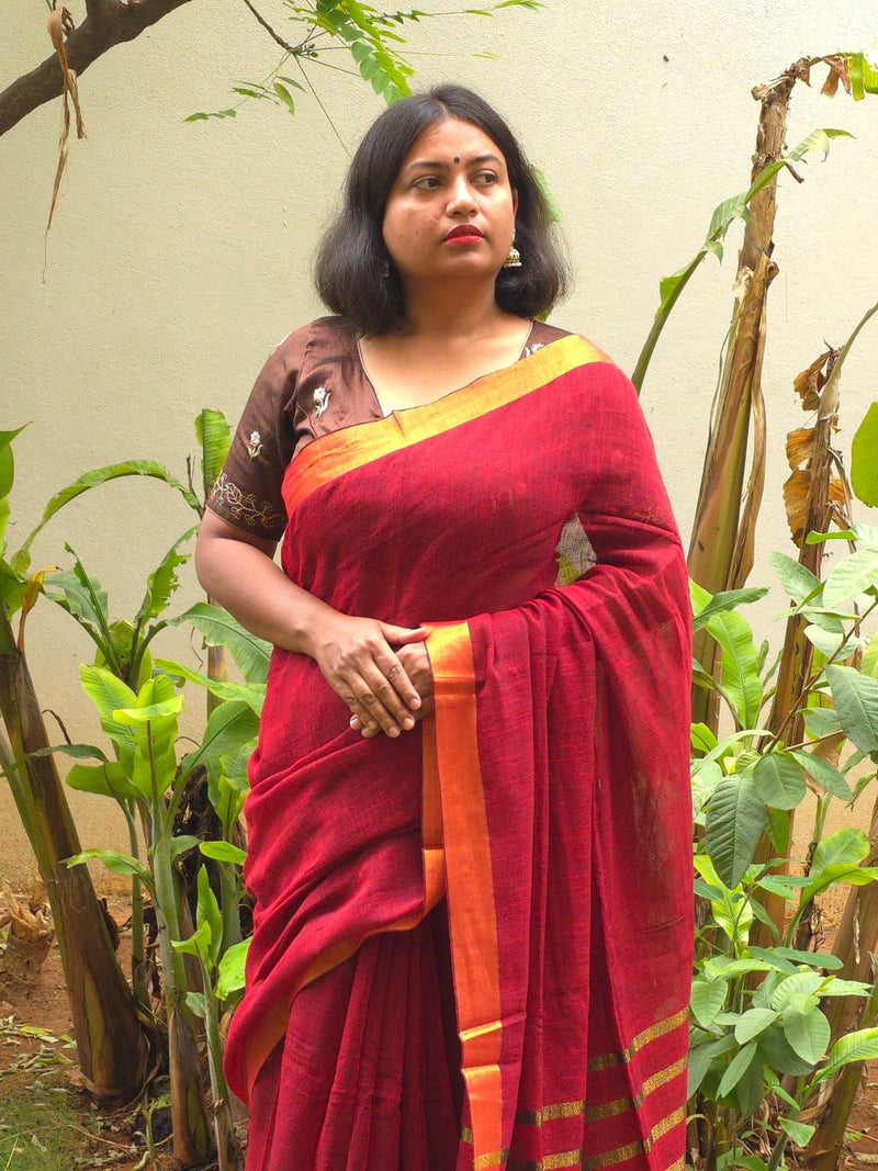 Sitara - Red Linen Saree with Copper Zari border