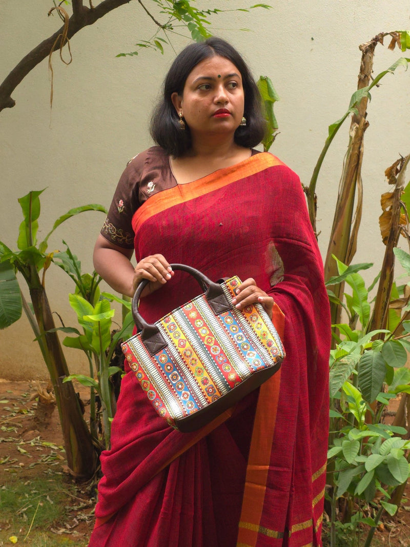 Sitara - Red Linen Saree with Copper Zari border