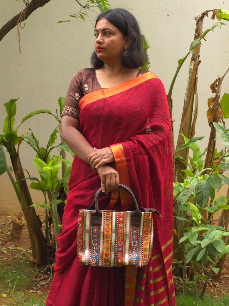 Sitara - Red Linen Saree with Copper Zari border